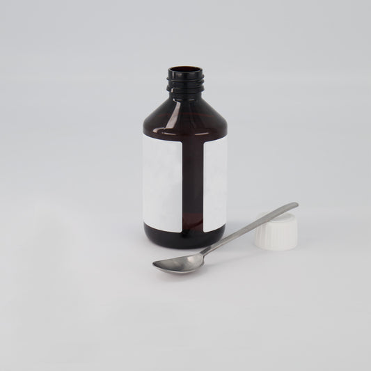 A bottle with a spoon