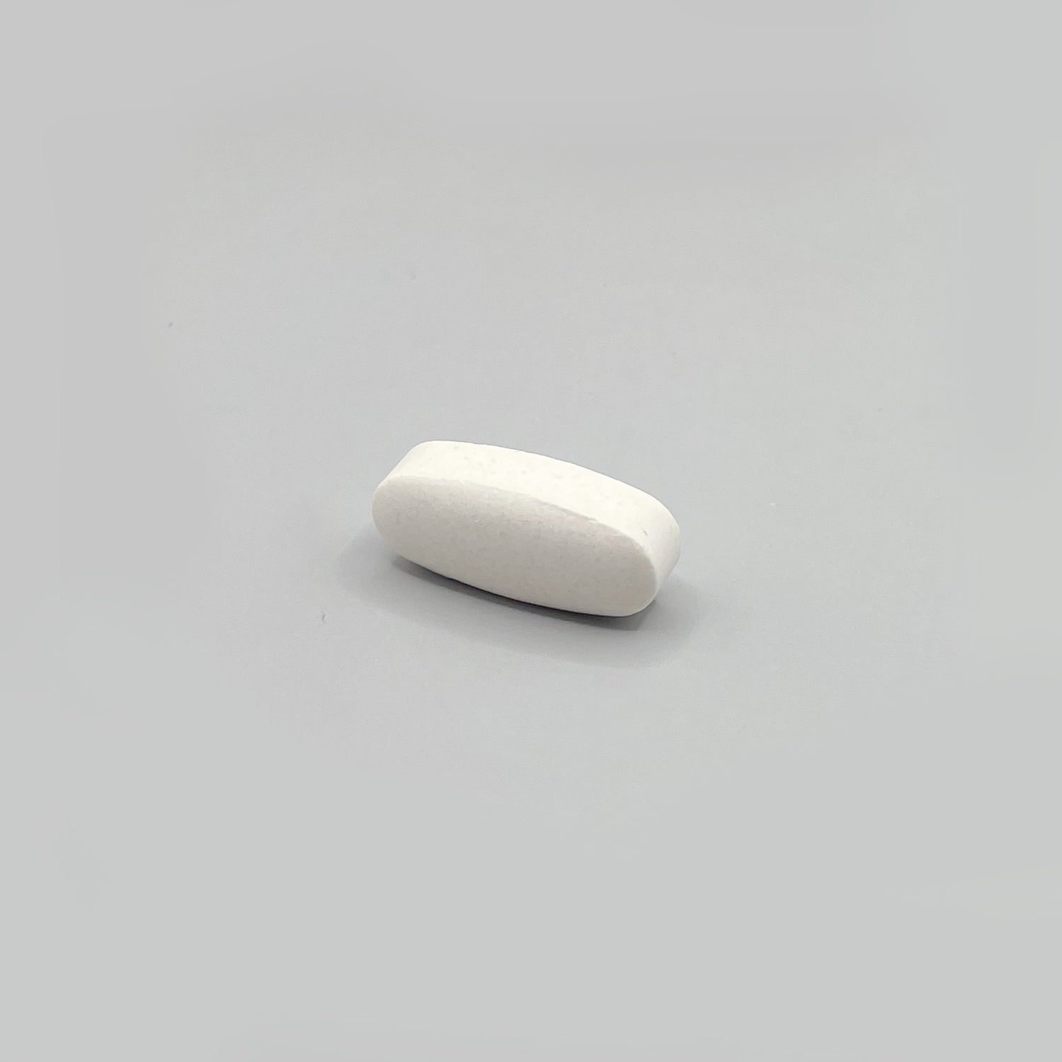 Oval white pill